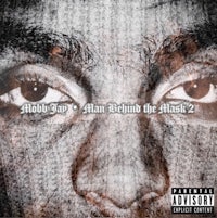 the cover of a man behind the mask 2