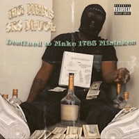 a man sitting on a bed with money on top of him